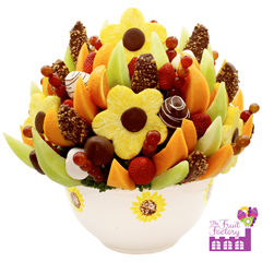 Fresh fruit bouquet of honeydew, cantaloupe, grapes, chocolate covered strawberries and apple slices
