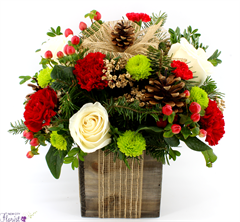 Holiday Cube includes white roses, red carnations, buttons, eucalyptus and pine cones in a wooden 