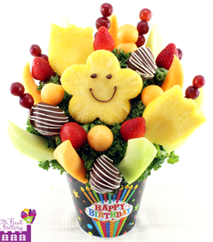 Fresh fruit bouquet of honeydew, chocolate covered strawberries and flower shaped pineapple slices
