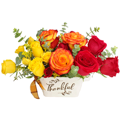 Thankful Roses includes yellow, orange and red roses in a thankful ceramic container